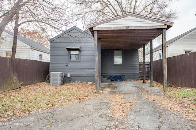 view of side of property featuring central AC