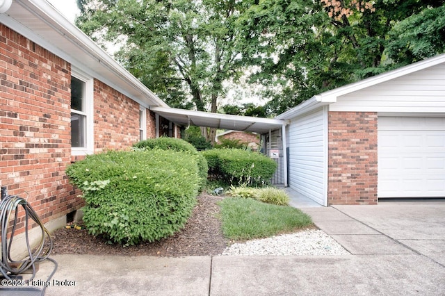 view of home's exterior featuring a carport