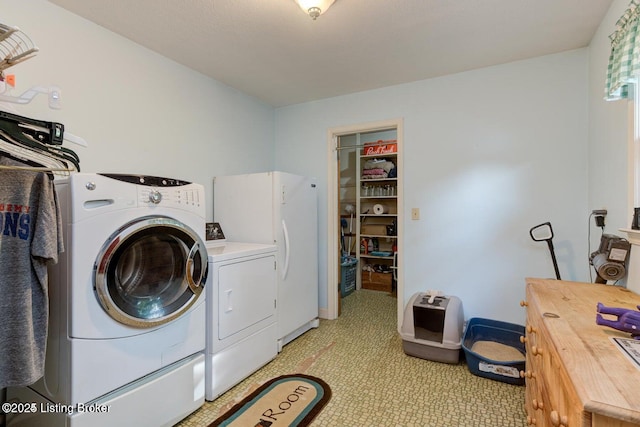 laundry area featuring cabinets and washer and dryer