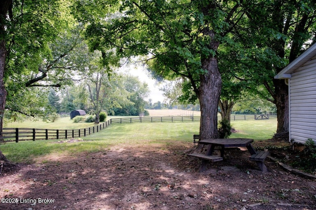 view of yard with a rural view