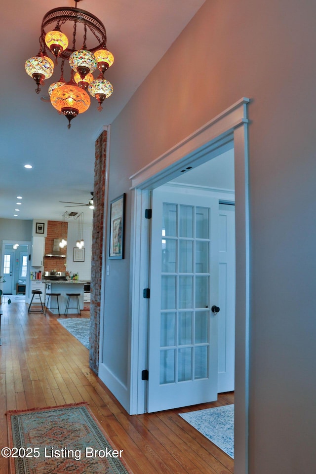 corridor featuring hardwood / wood-style flooring