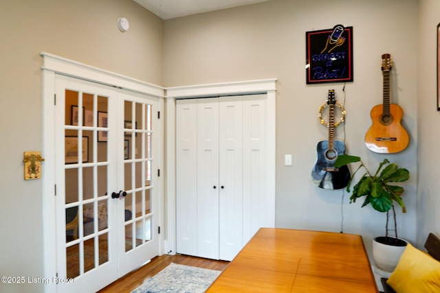 interior space with hardwood / wood-style flooring and french doors