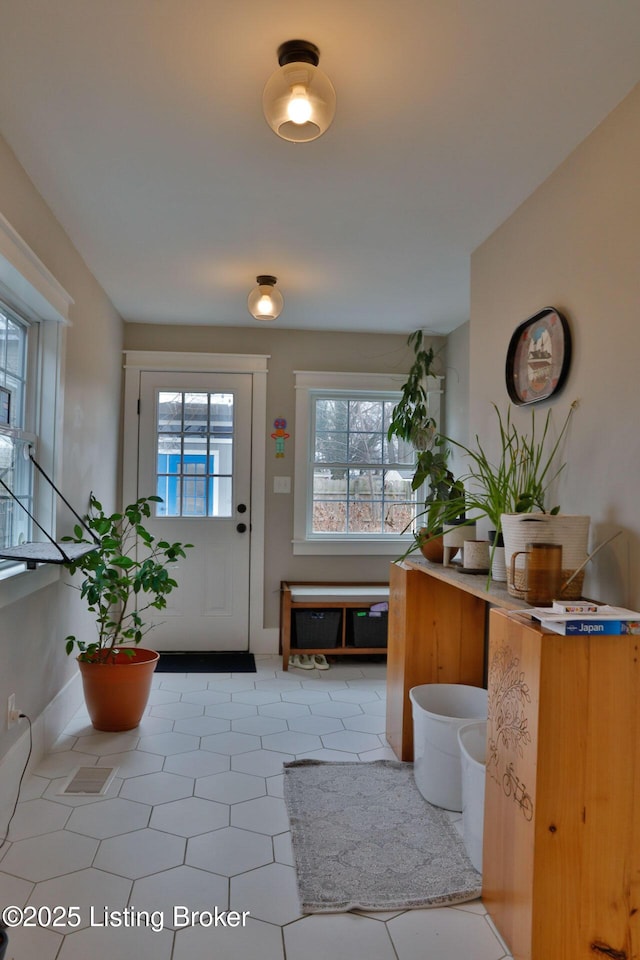 interior space with light tile patterned floors