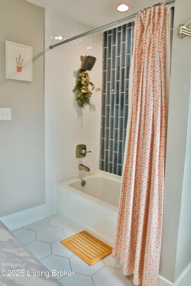 bathroom featuring tile patterned flooring and shower / tub combo