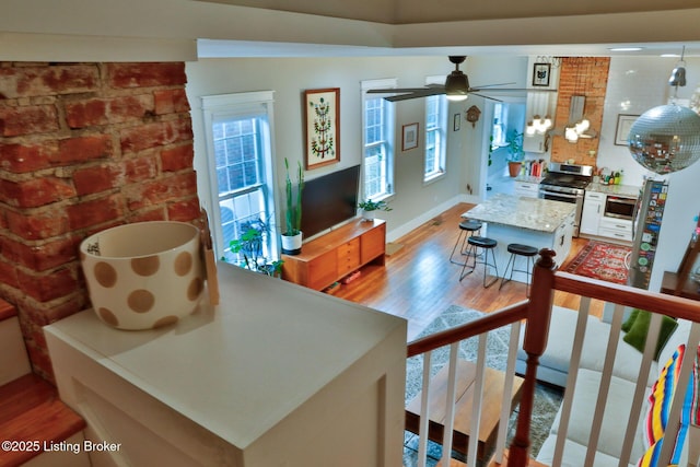 interior space featuring hardwood / wood-style flooring and ceiling fan