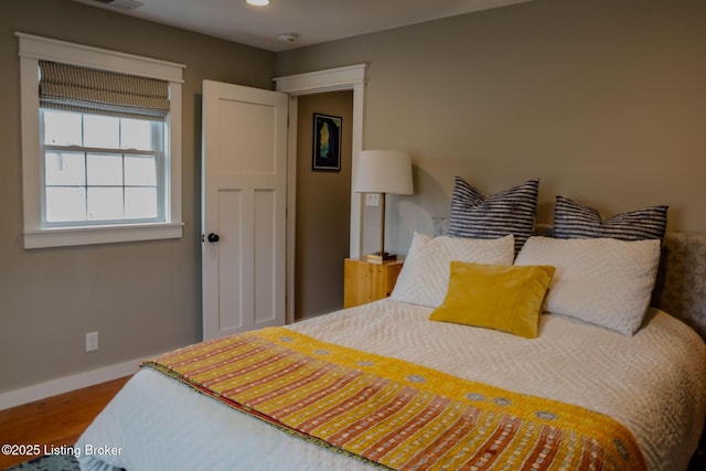 bedroom featuring wood-type flooring