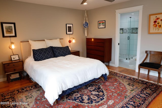 bedroom with hardwood / wood-style flooring, ceiling fan, and ensuite bathroom