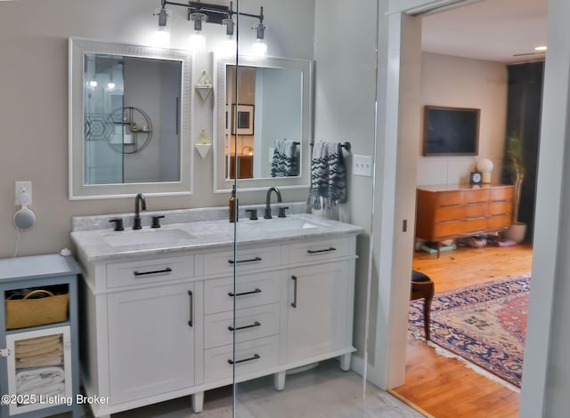 bathroom with vanity and hardwood / wood-style floors