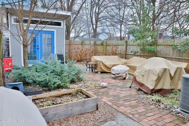 view of patio / terrace with central AC and french doors