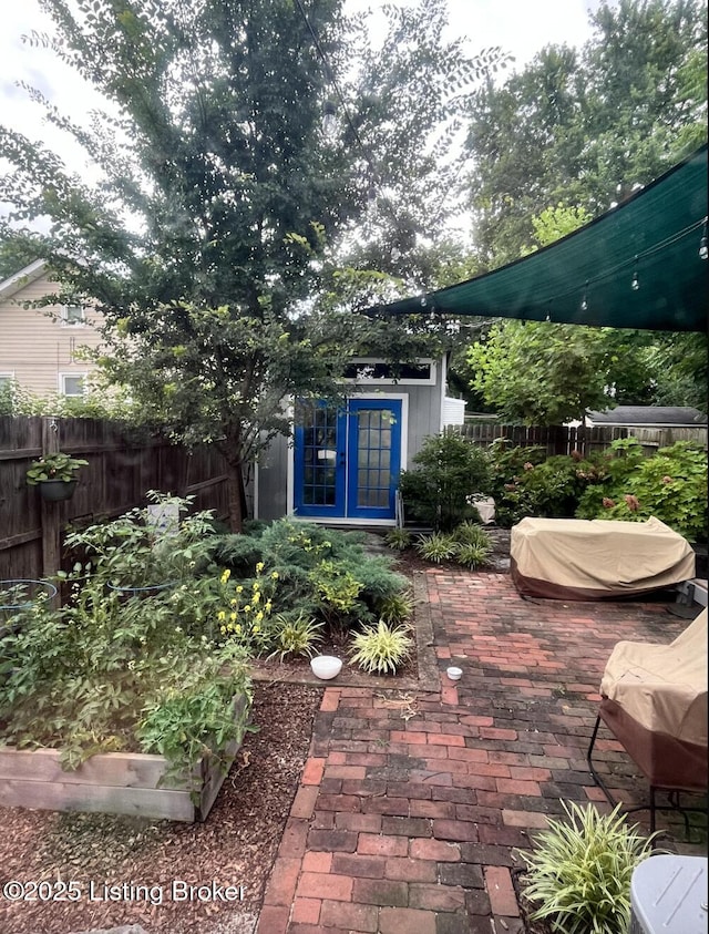 view of patio featuring an outdoor structure