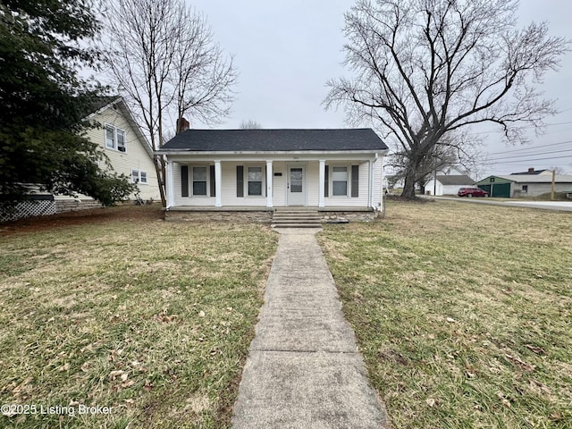 bungalow-style house with a front yard and covered porch