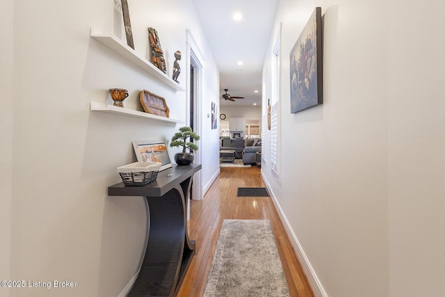 hall with light wood-type flooring