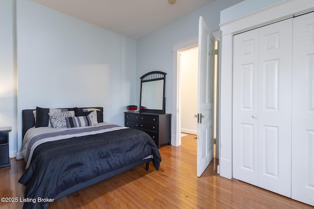 bedroom featuring hardwood / wood-style flooring and a closet