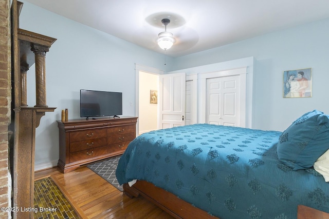 bedroom featuring hardwood / wood-style flooring and ceiling fan