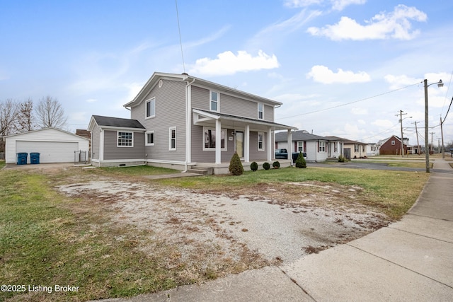 view of front facade featuring a garage, an outdoor structure, and a front yard