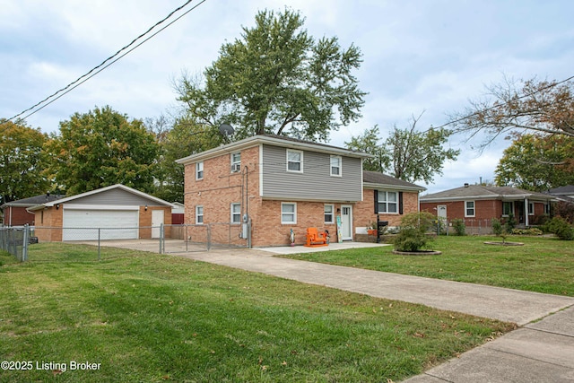 split level home featuring a garage, an outdoor structure, and a front lawn