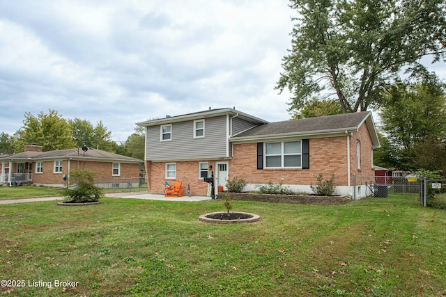 view of front of home featuring a front lawn and a patio area