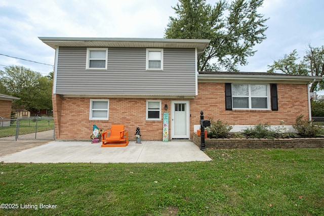 back of house with a yard and a patio area