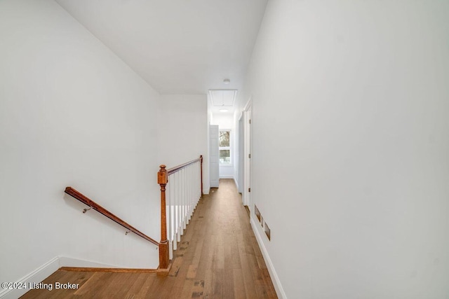 corridor featuring hardwood / wood-style floors