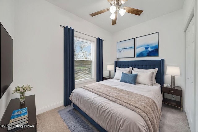 carpeted bedroom with baseboards