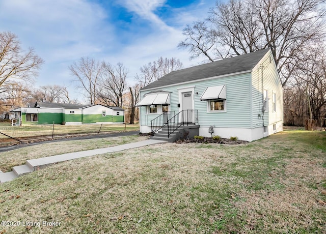 view of front of property with a front lawn