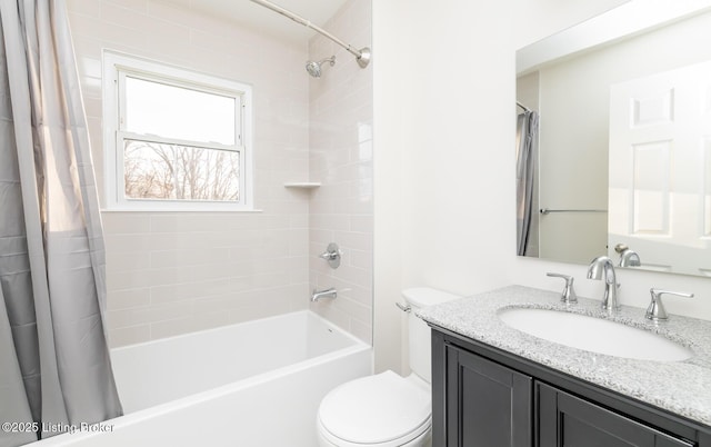 full bathroom with vanity, shower / bath combination with curtain, and toilet