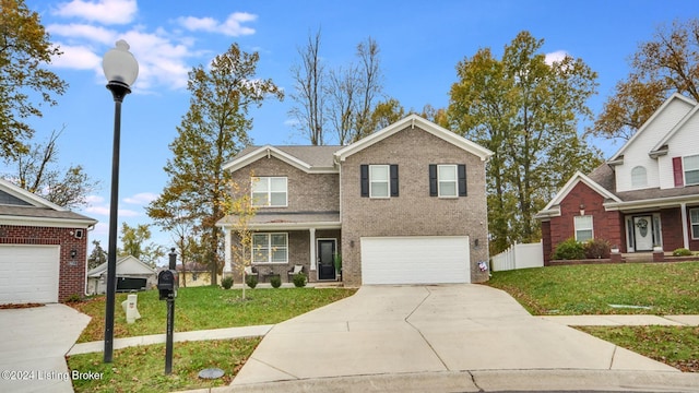 view of front of property with a garage and a front yard