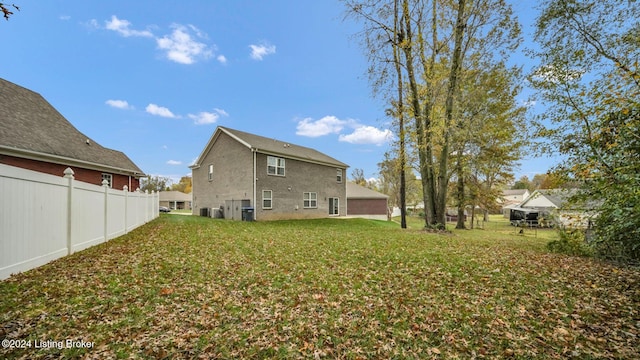 back of property featuring a yard