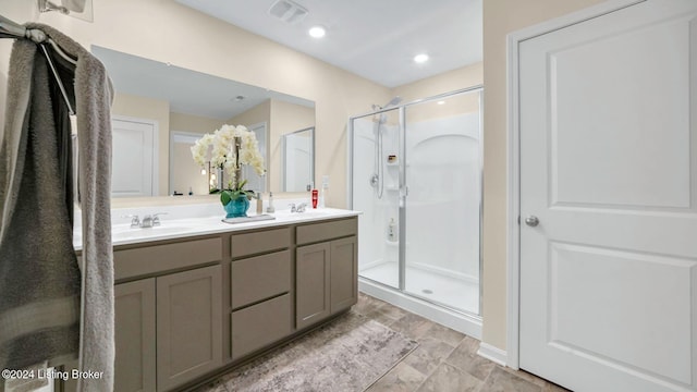 bathroom featuring vanity and walk in shower