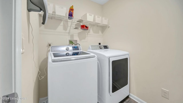 laundry area with washing machine and dryer