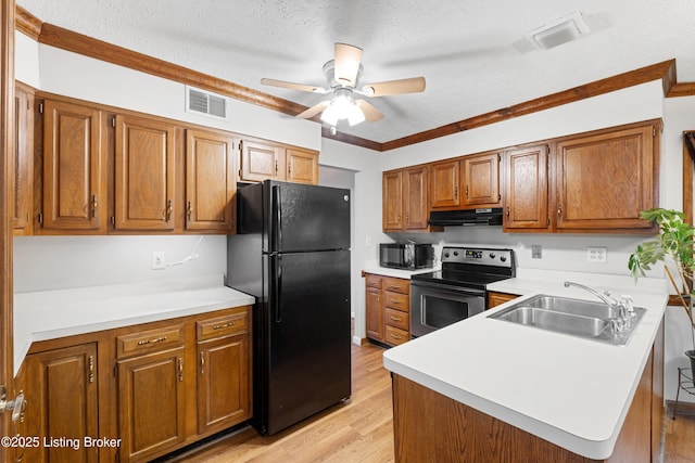 kitchen featuring sink, ceiling fan, black appliances, a textured ceiling, and light wood-type flooring