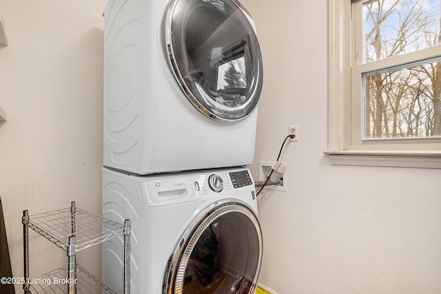 washroom with stacked washer / dryer