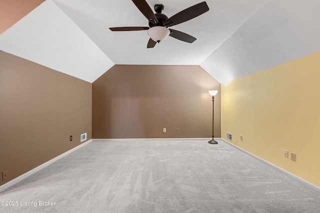 bonus room featuring lofted ceiling, carpet flooring, and ceiling fan