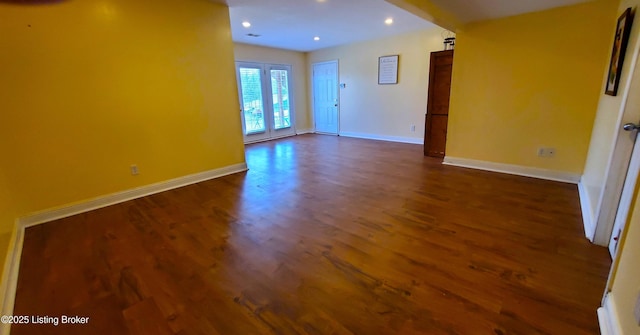 unfurnished room featuring dark hardwood / wood-style flooring