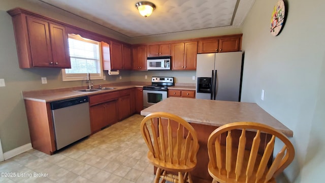 kitchen featuring appliances with stainless steel finishes and sink