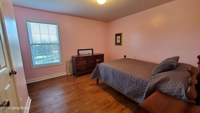 bedroom featuring hardwood / wood-style floors