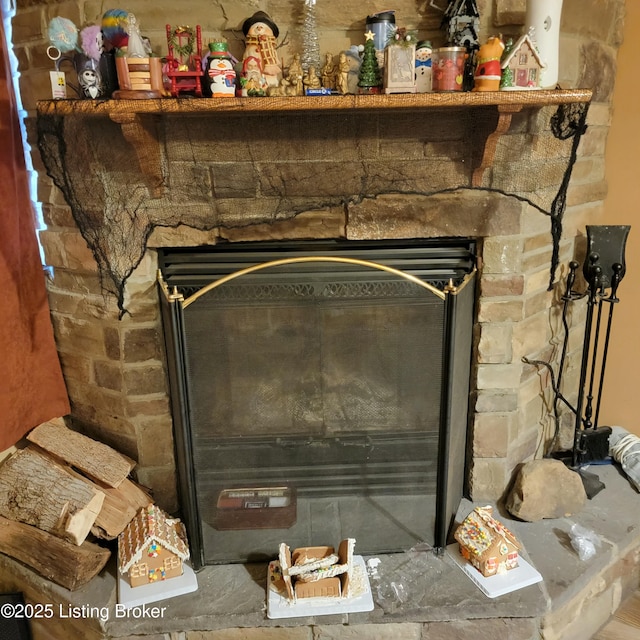 details with a stone fireplace