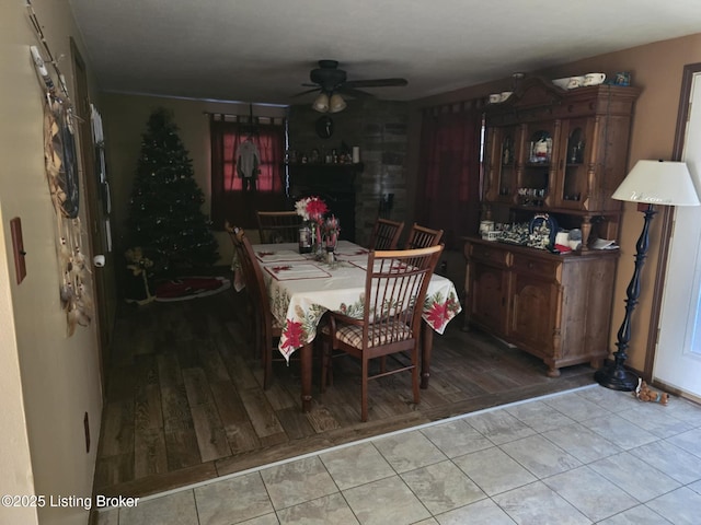 dining area with light hardwood / wood-style flooring and ceiling fan