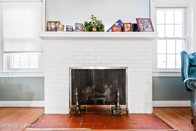 room details with hardwood / wood-style flooring and a brick fireplace