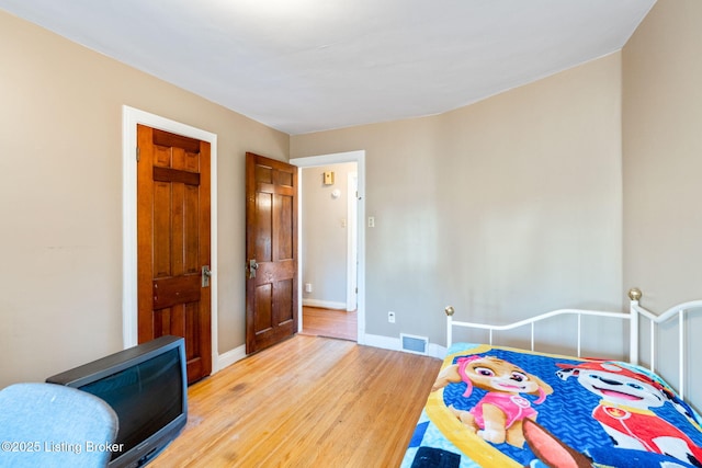 bedroom featuring hardwood / wood-style floors