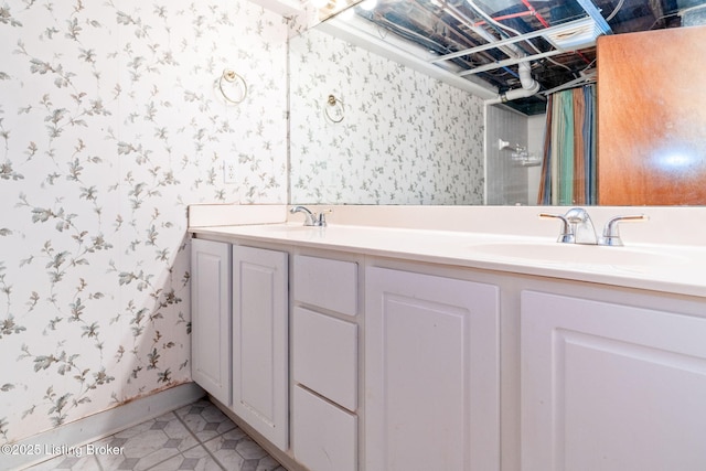 bathroom with tile patterned floors and vanity