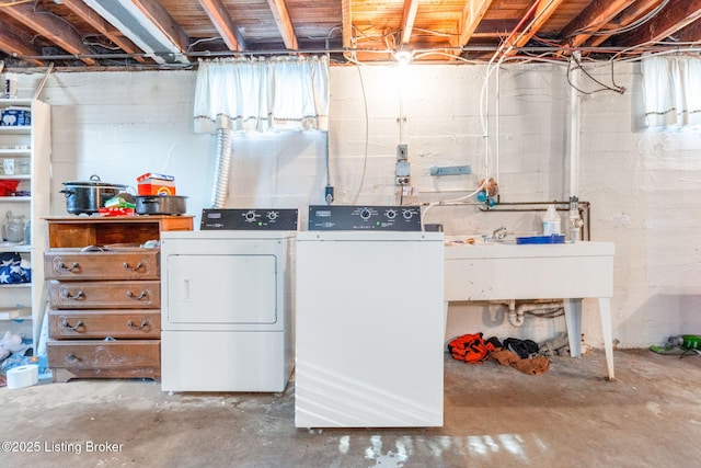 clothes washing area featuring washing machine and dryer