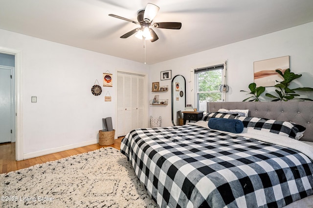 bedroom featuring a closet, ceiling fan, and light wood-type flooring