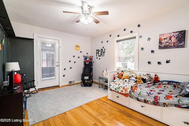 bedroom with wood-type flooring and ceiling fan