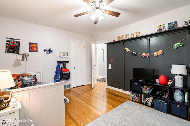 interior space featuring ceiling fan and wood-type flooring