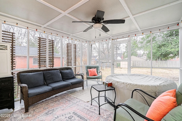 sunroom with coffered ceiling and ceiling fan