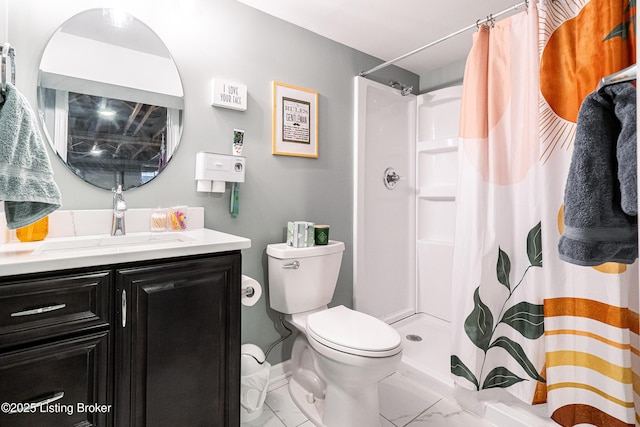 bathroom with vanity, toilet, and curtained shower