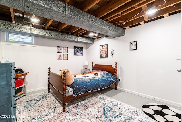 bedroom featuring concrete floors