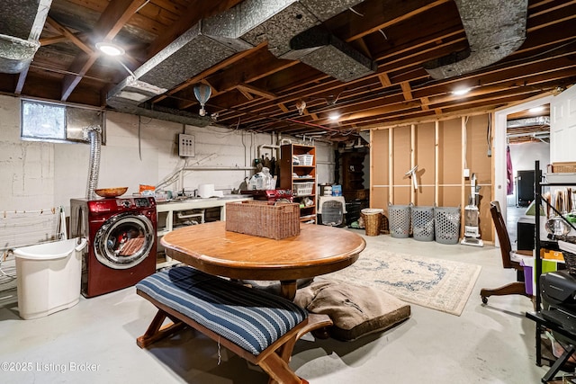 basement featuring washer / dryer and a workshop area