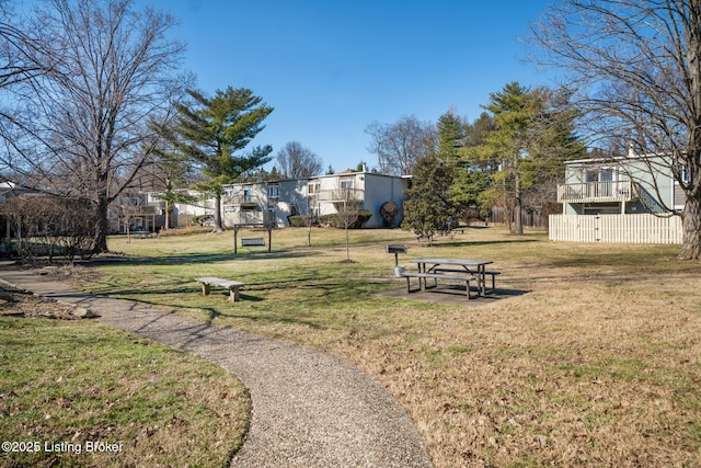 view of property's community featuring a yard